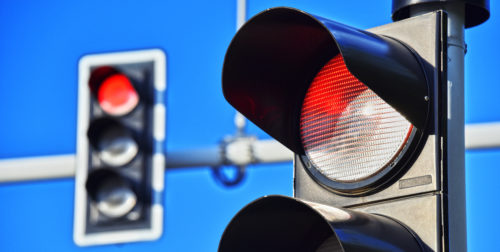 Traffic lights over blue sky